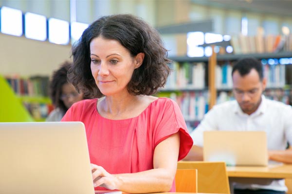 A student looking at her computer