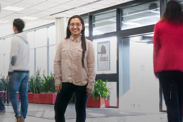 Guest student standing in the BHCC lobby