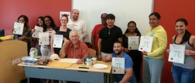 STEM Students holding their certificates