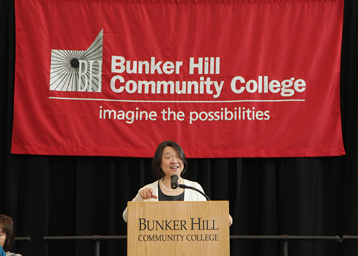 Pam Eddinger speaking at the podium
