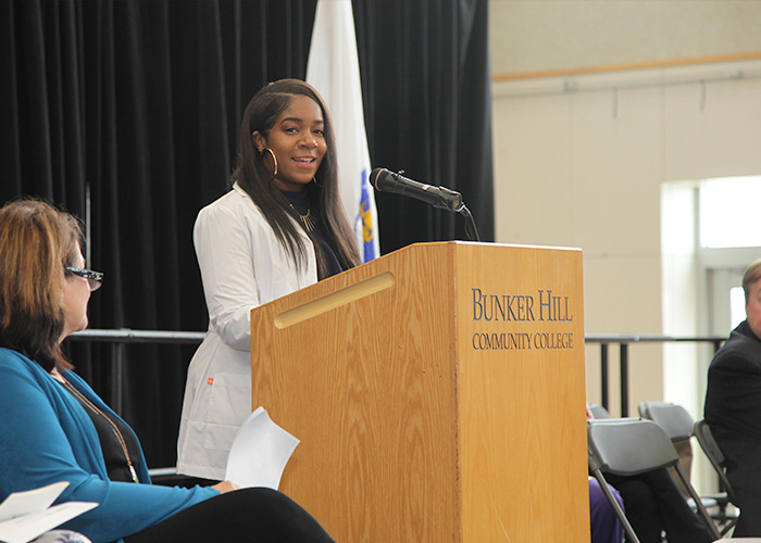 student speaker at the podium on stage