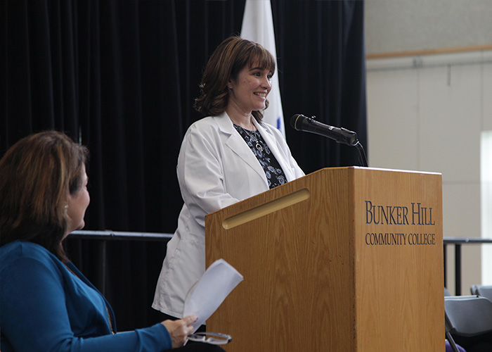 student speaker at the podium on stage