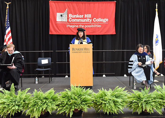 Kim Frashure giving a speech at a podium