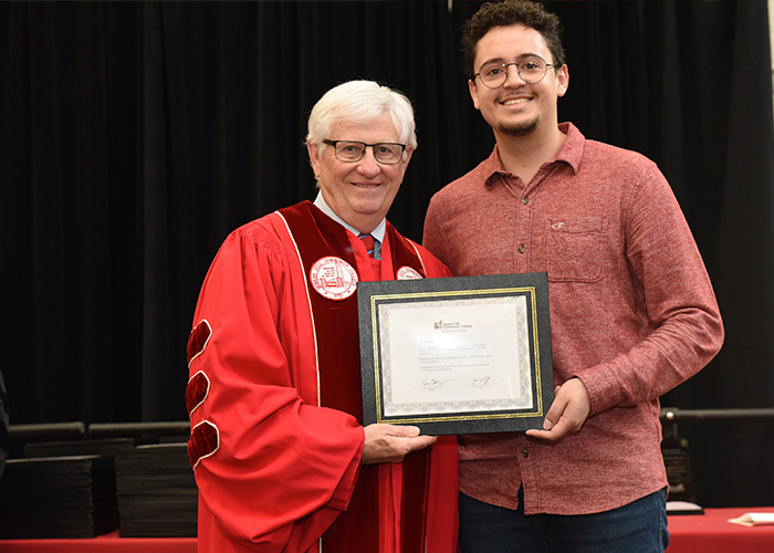 student receiving his award