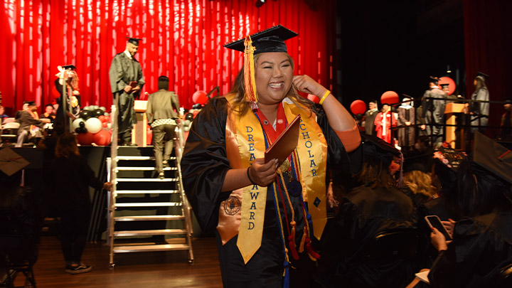 Student graduate walking