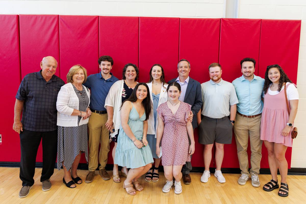Student posing with family