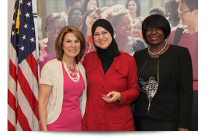 student posing with faculty