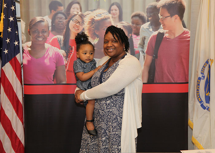 female student posing with daughter 