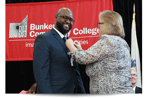 thumbnail of male student receiving his nurse pin