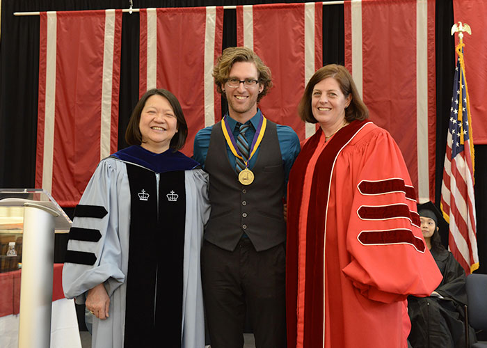 male student with the president and Amy Young