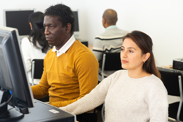 2 people on computers