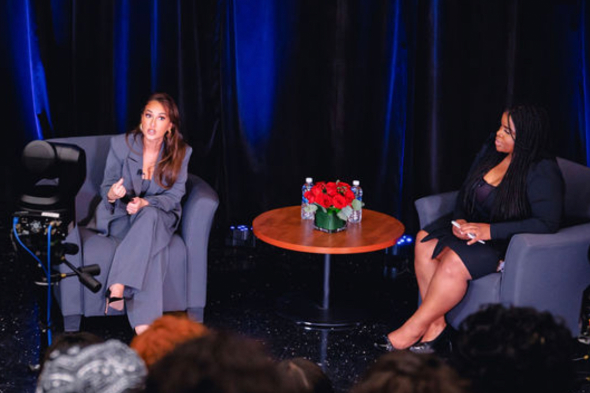 Adrienne Bailon-Houghton being interviewed on stage