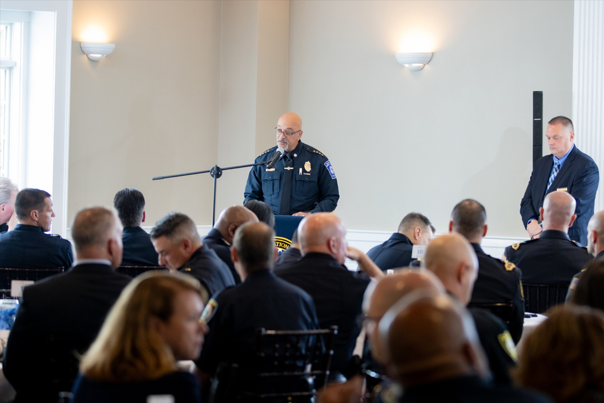 Chief Barrows speaking at podium to audience