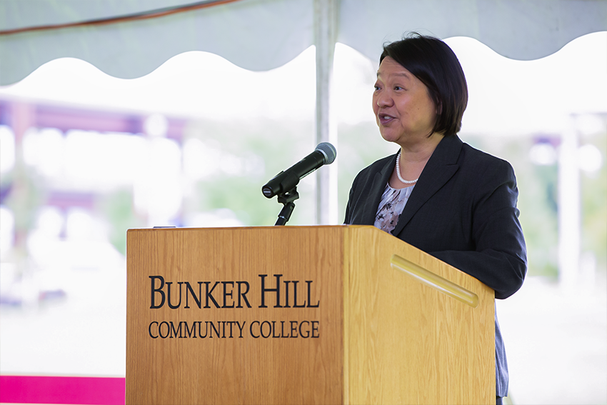 President Pam standing on pulpit