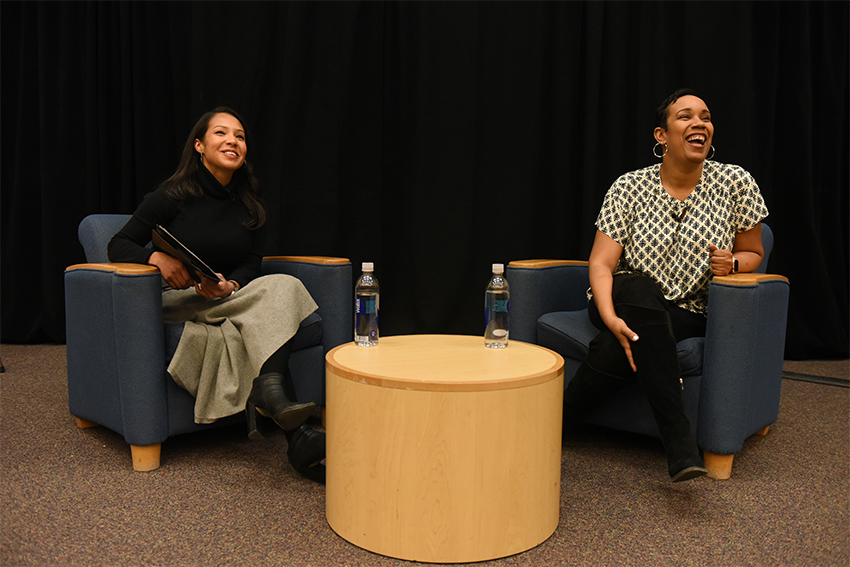 Elle Simone sitting with Melissa Castro