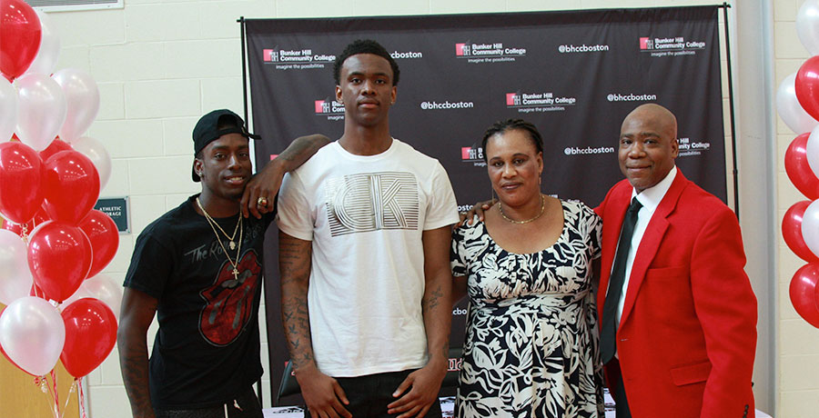 Fredens Deneus with his friend, mother and coach