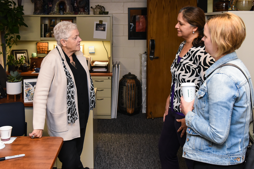 Gina McCarthytalking with two attendees