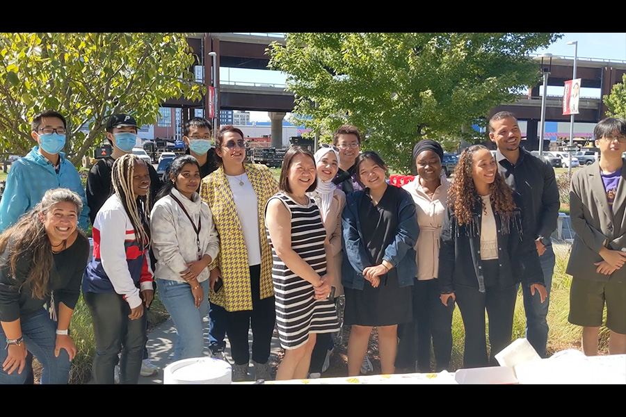 Group photo of international students with the president