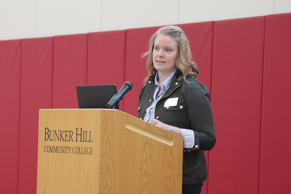 Colleen Yee speaking at a podium