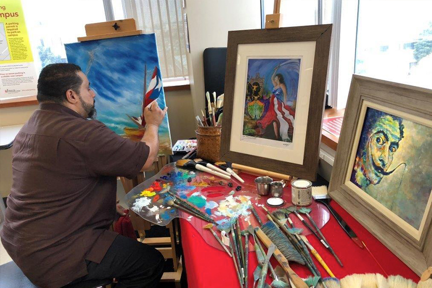 artist panting at an easel