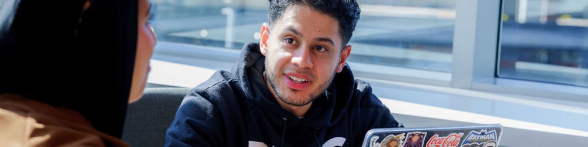 students with a a laptop 