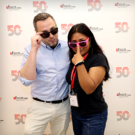 Michael Costello of Student Central poses for photo with student employee Ranu Khatri at 50th Anniversary Celebration.
