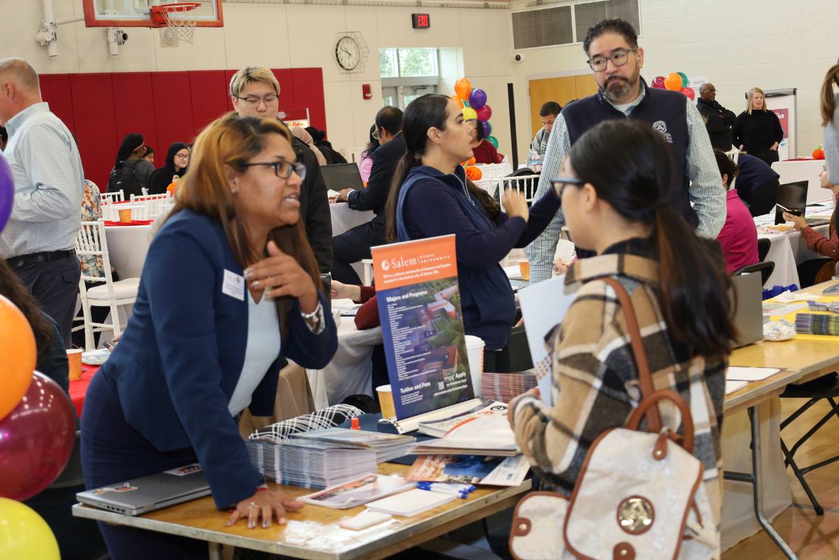 Students talking to a college rep