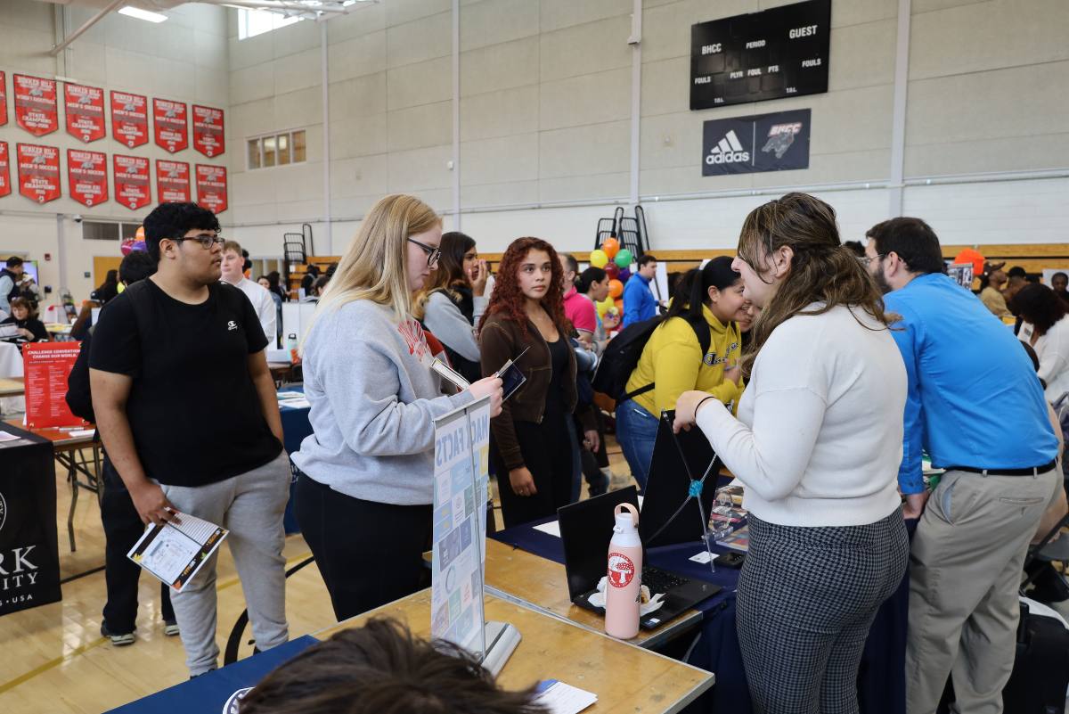 Students talking to a college rep