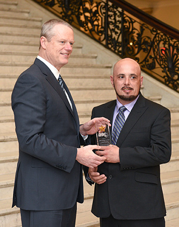 Governor Baker shakes hands with John Gonsalves