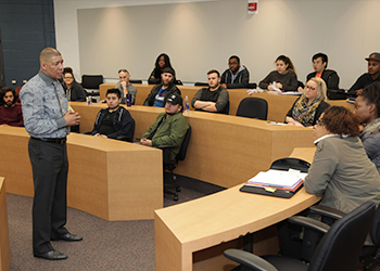 Dewey Bozella talks with students