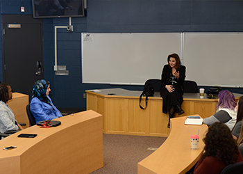 Kathy Najimy speaking to students