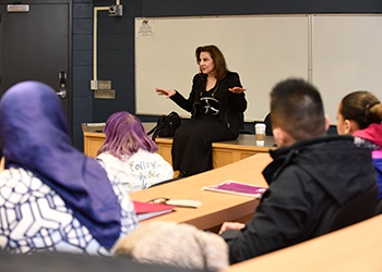 Kathy Najimy speaking with students