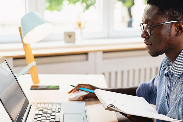 A man sitting using a computer