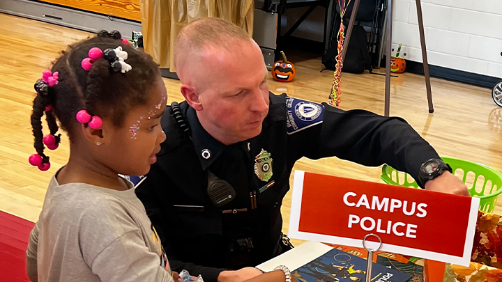 Officer and child at Fall event