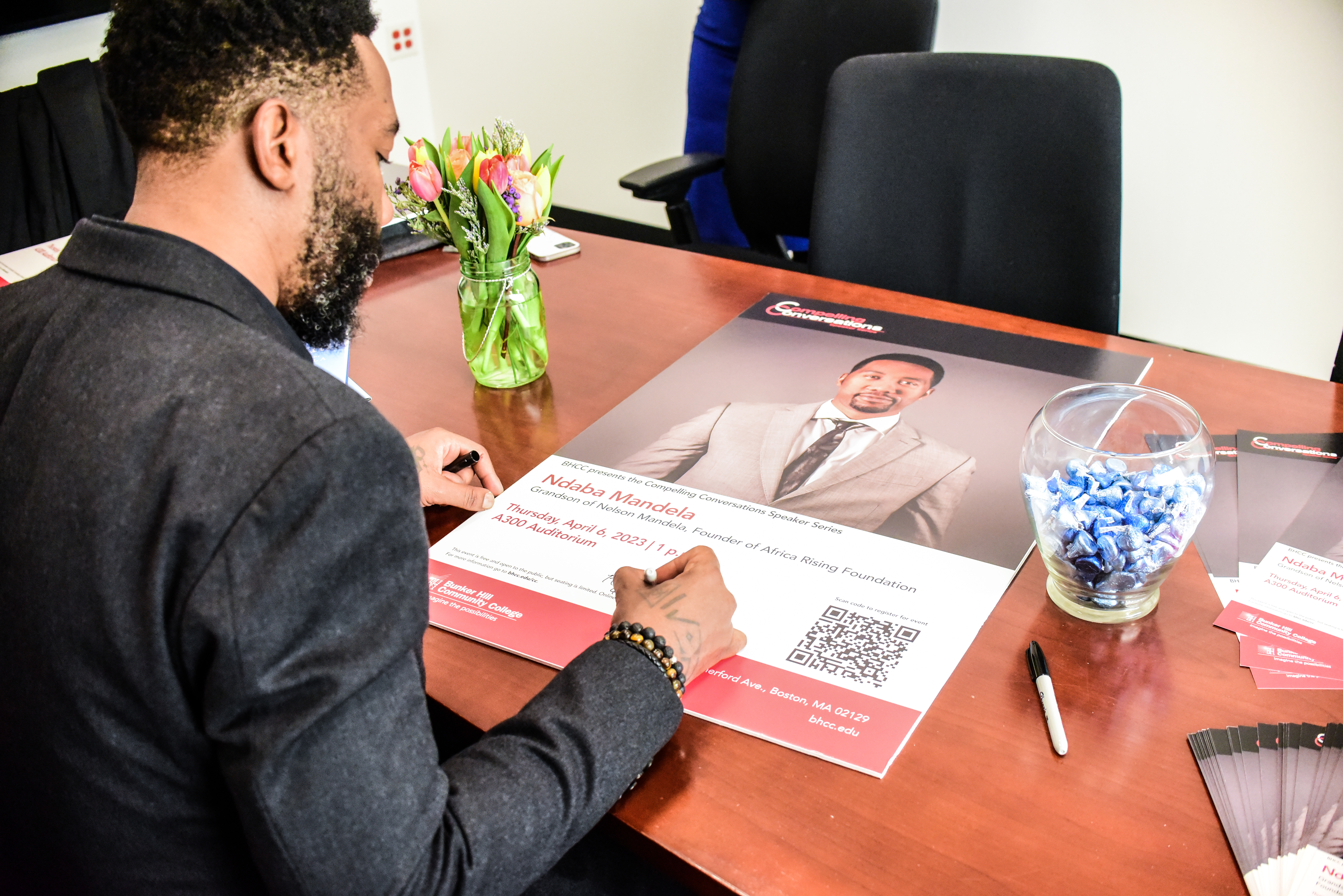 Nadaba Mandela signing a poster