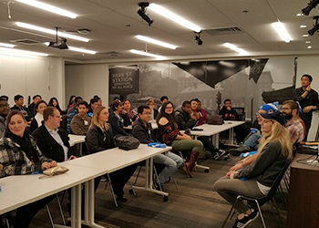 Classroom of students listening to the google tour presentation