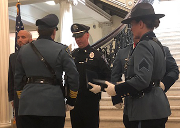 Officer Cuddahy receiving an award