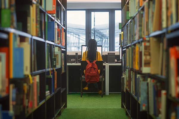 A woman studying in a library